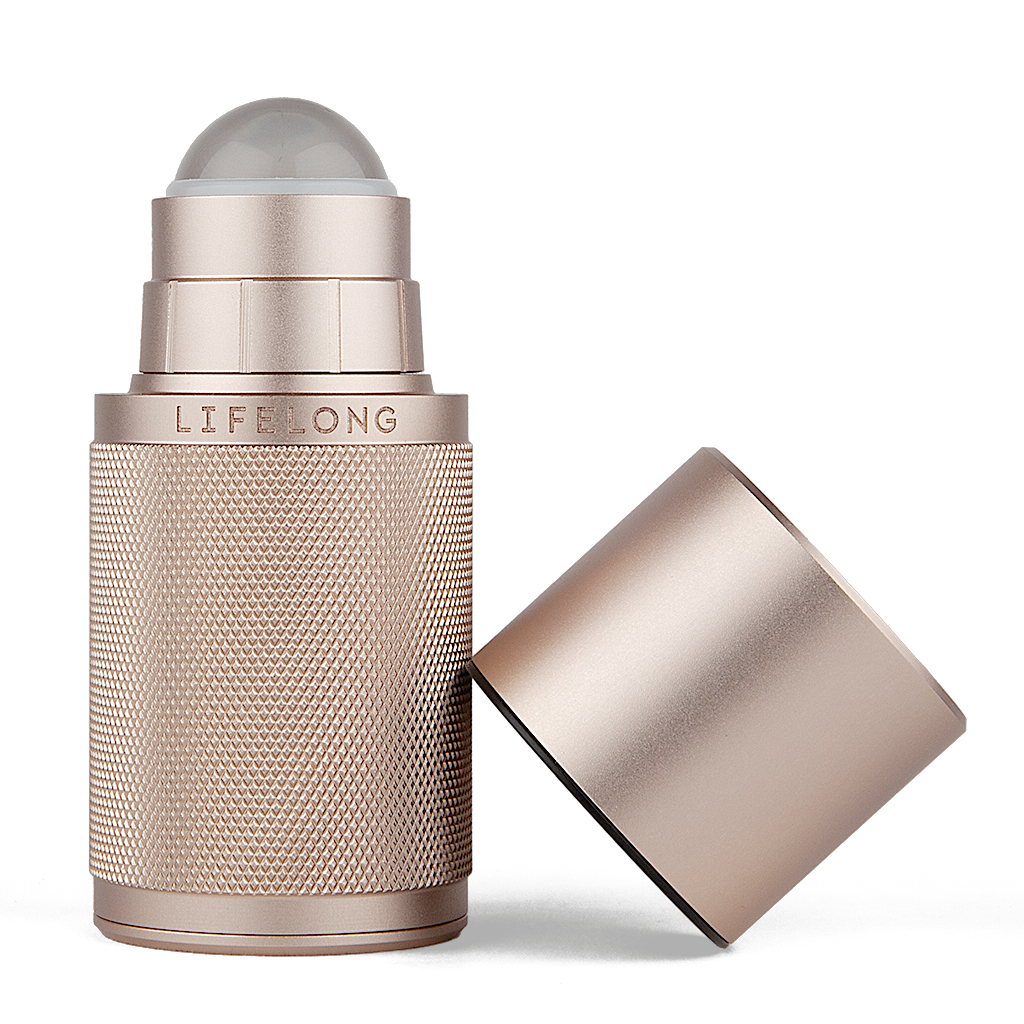 Rose-coloured refillable deodorant with lid off. It has knurled texture and a Lifelong logo in the middle. The lid has dark discrete details.