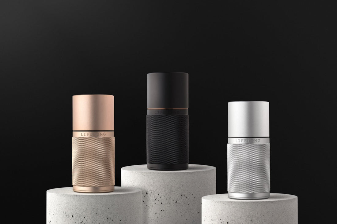 Lifelong Deodorant refillable applicators in Oslo Rose, Stockholm Black and Copenhagen Silver on concrete plinths — sustainable UK deodorant brand