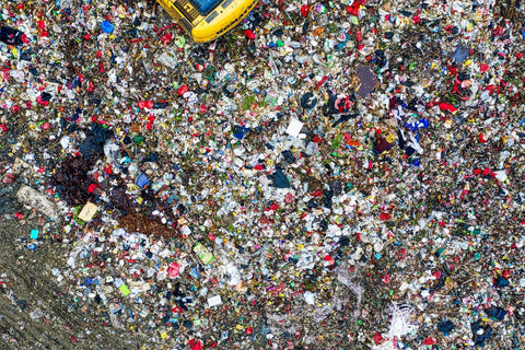 A bird's eye view of a sprawling garbage dump in Banten, Indonesia.
