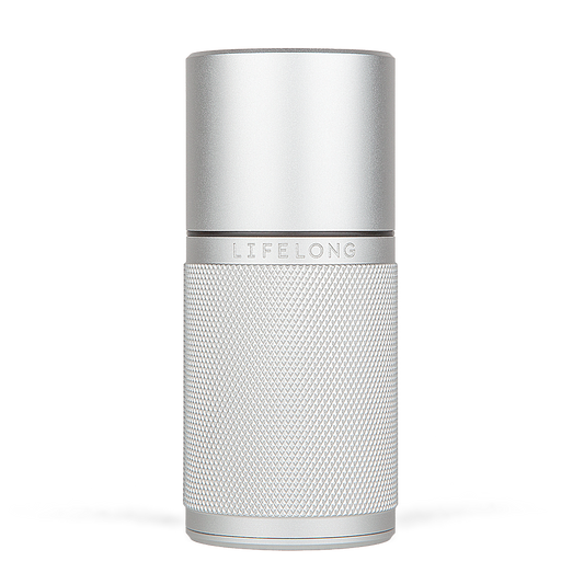 Silver-coloured refillable deodorant with knurled texture, small black details and a logo saying Lifelong in the middle.