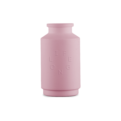 Pink silicone sleeve for the Lifelong refillable deodorant, debossed Lifelong logo