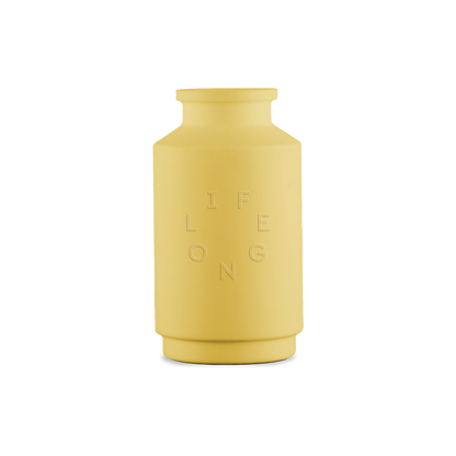 Yellow silicone sleeve for the Lifelong refillable deodorant, debossed Lifelong logo